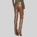 Fashionable brown leather pants women back view