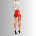 Back view of fashionable red leather mini skirt