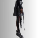 "Black leather fringe skirt - side view"