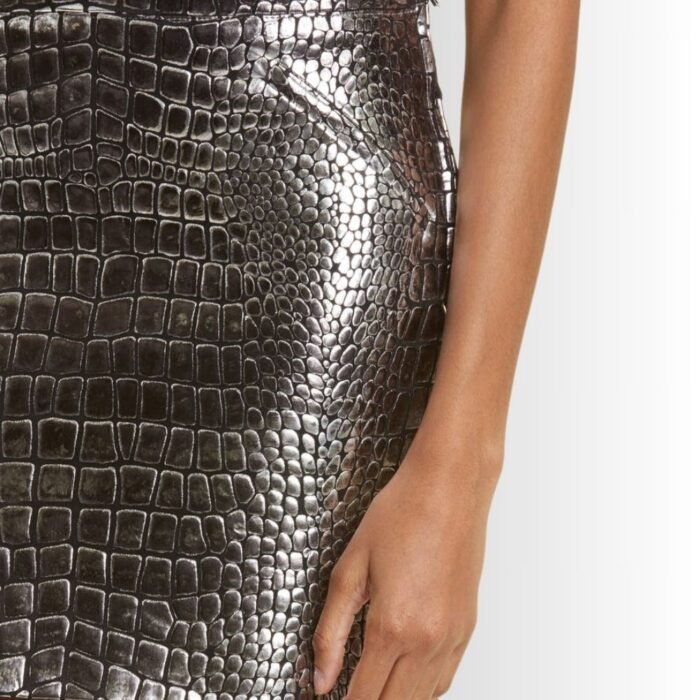 Close-up of metallic leather mini skirt