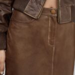 Close-up of texture on brown leather midi skirt
