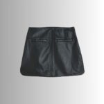 Full view of mini black leather skirt"